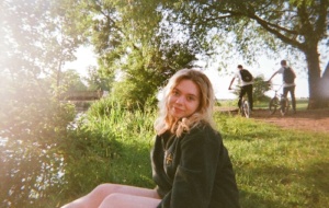 Blonde woman smiling in park