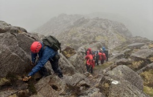 Mountain climbers climbing a mountain