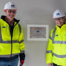 David Frederick and Sophia Lynn next to the plaque, during their visit to the Univ North site in October 2024