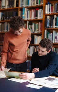 Czech translation project - Jamie & Miles looking at the letters (portrait)