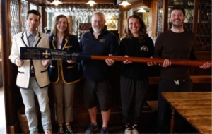 Univ boat club members collect the 1946 Summer Eights blade